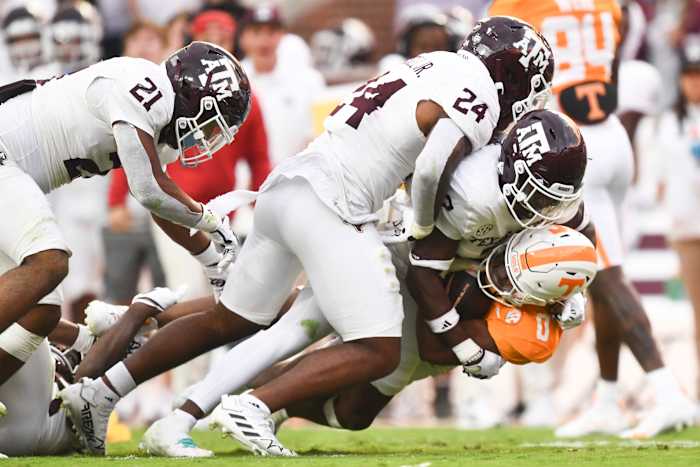 Oct 14, 2023; Knoxville, TN, USA; Tennessee running back Jaylen Wright (0) is tackled by multiple Texas A&M players during a football game between Tennessee and Texas A&M at Neyland Stadium in Knoxville, Tenn., on Saturday, Oct. 14, 2023.